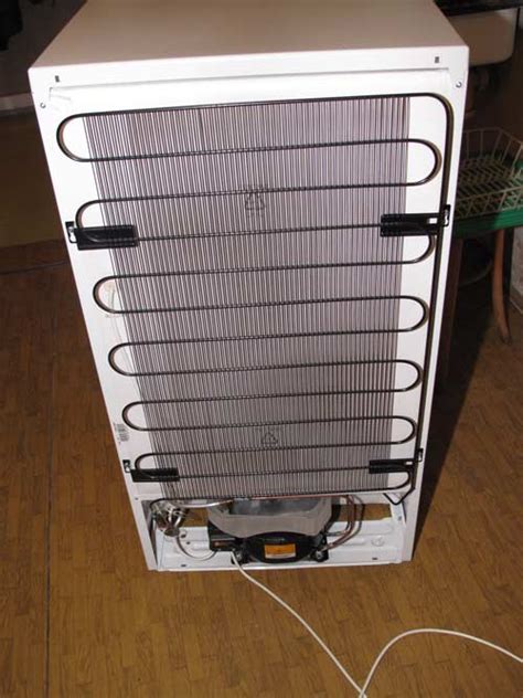 Open the <b>freezer</b> door and remove the base grille by removing 2 Phillips-head screws and pulling the grille toward you. . Where are the condenser coils on a whirlpool upright freezer